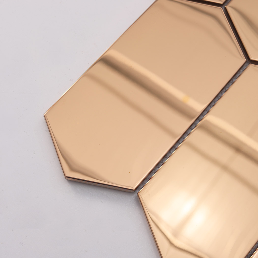 Close up of rose gold mirror elongated hexagon mosaic smooth surface