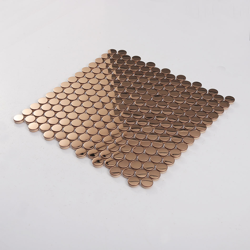 Angled view of rose gold mirror penny round metal mosaic tile