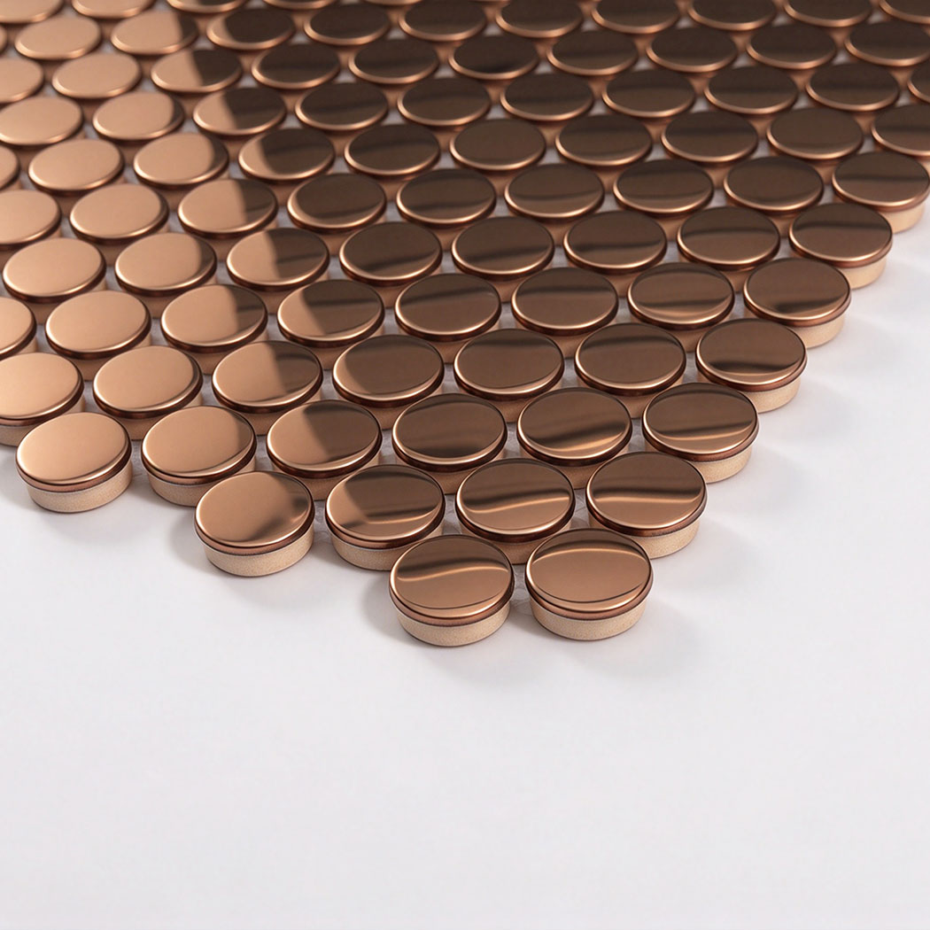 Edge detail of rose gold mirror penny round metal mosaic tile