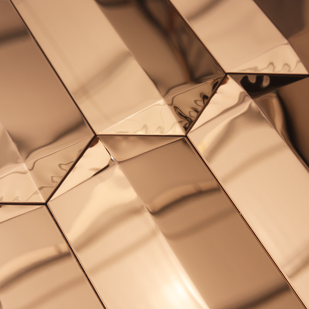Rose gold mirror picket mosaic close up showing beveled joints and reflections