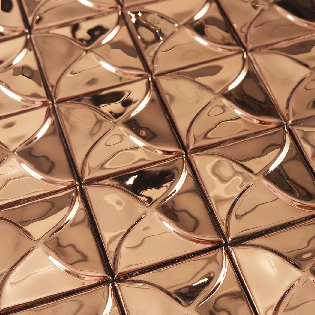 Rose gold mirror square mosaic close up showing raised curved pattern and reflections