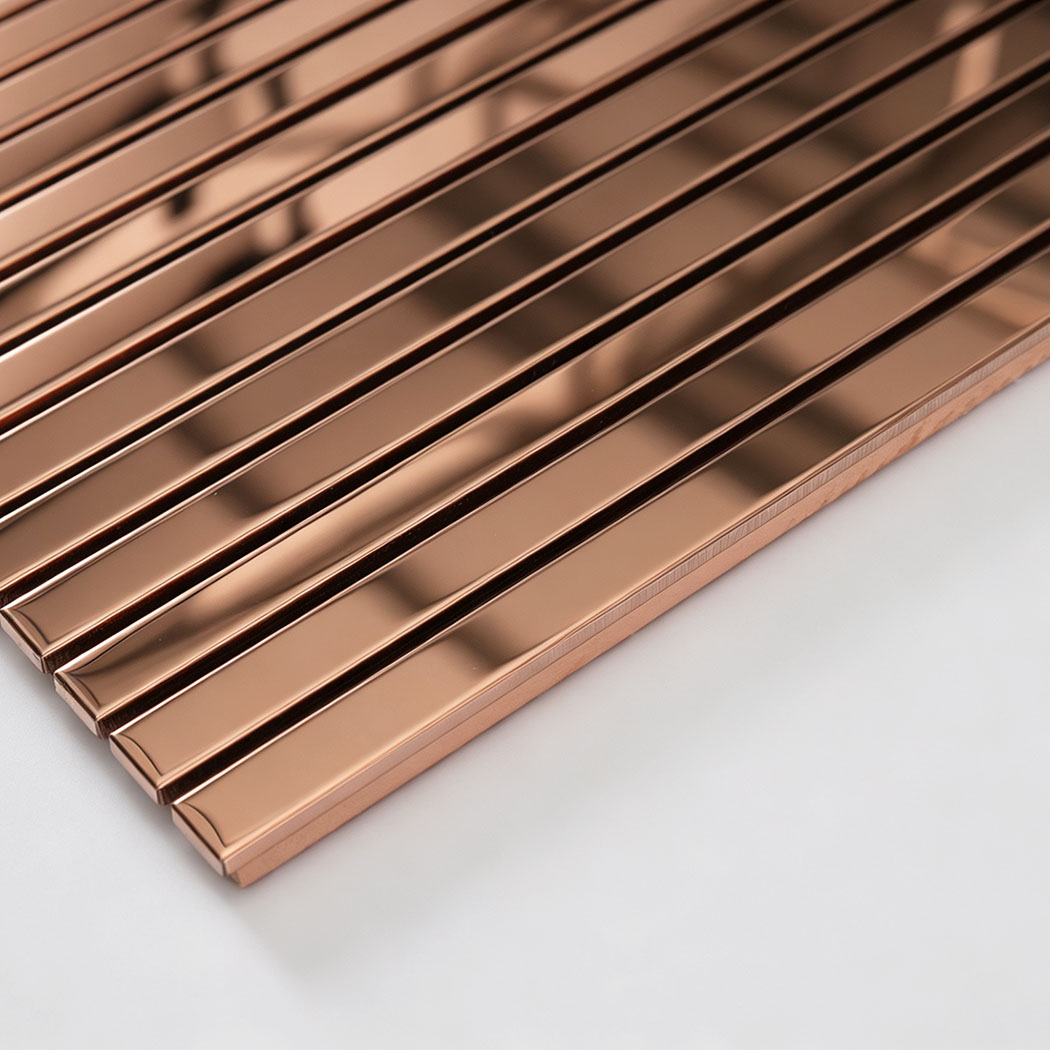 Edge detail of rose gold mirror stainless steel linear tile sheet