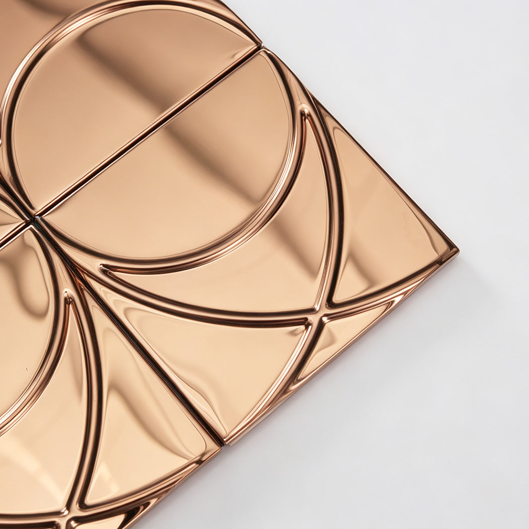 Corner close-up of rose gold mirror stainless steel square pattern mosaic tile