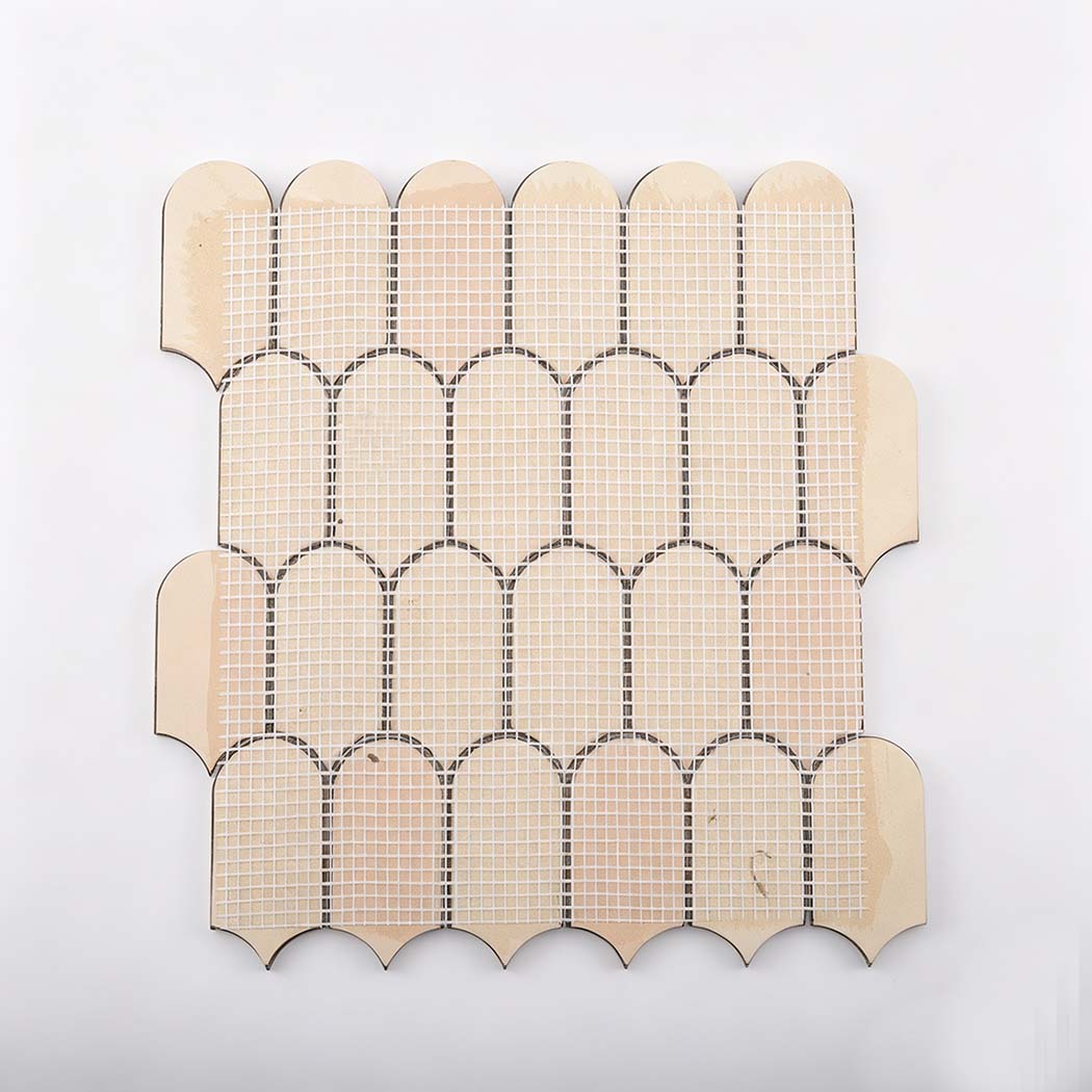 Back view of rose gold scallop metal mosaic tile sheet with mesh backing