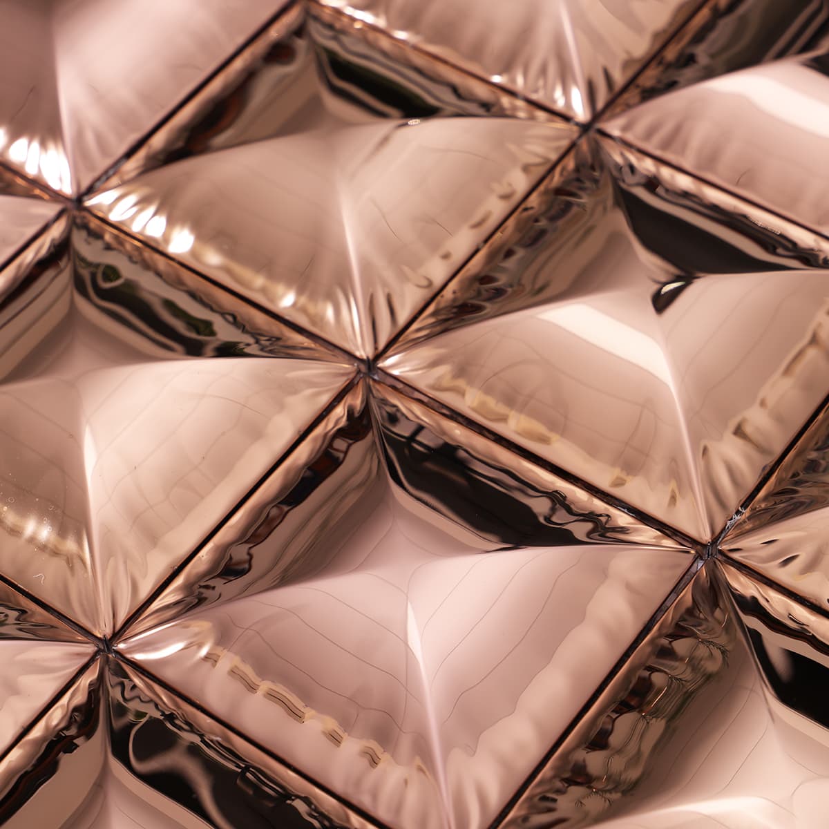 Detail texture of rose gold pyramid metal tile surface