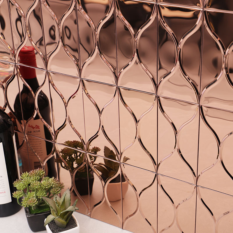 Close up of rose gold reflective metal tiles with elegant wavy lines