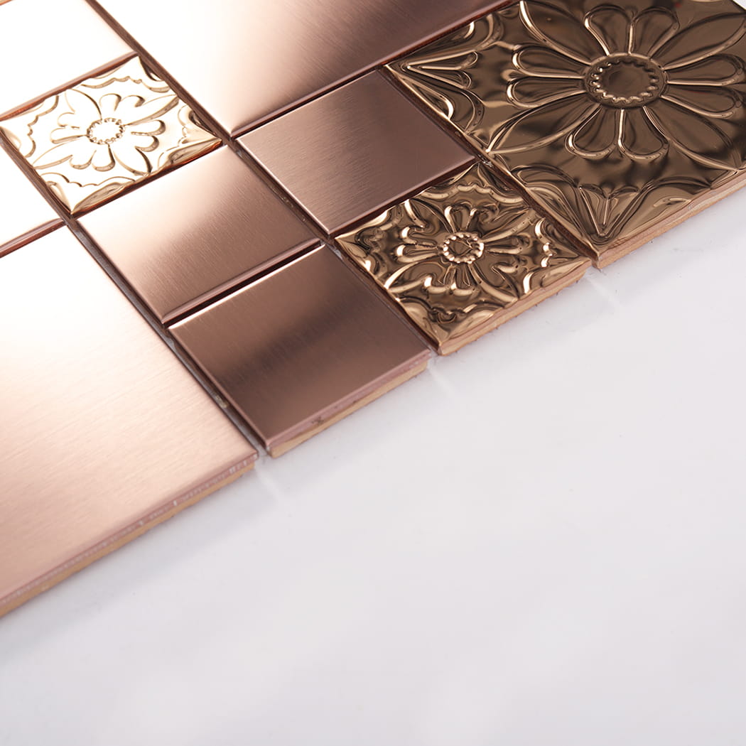 Texture detail of rose gold embossed floral metal mosaic tile surface