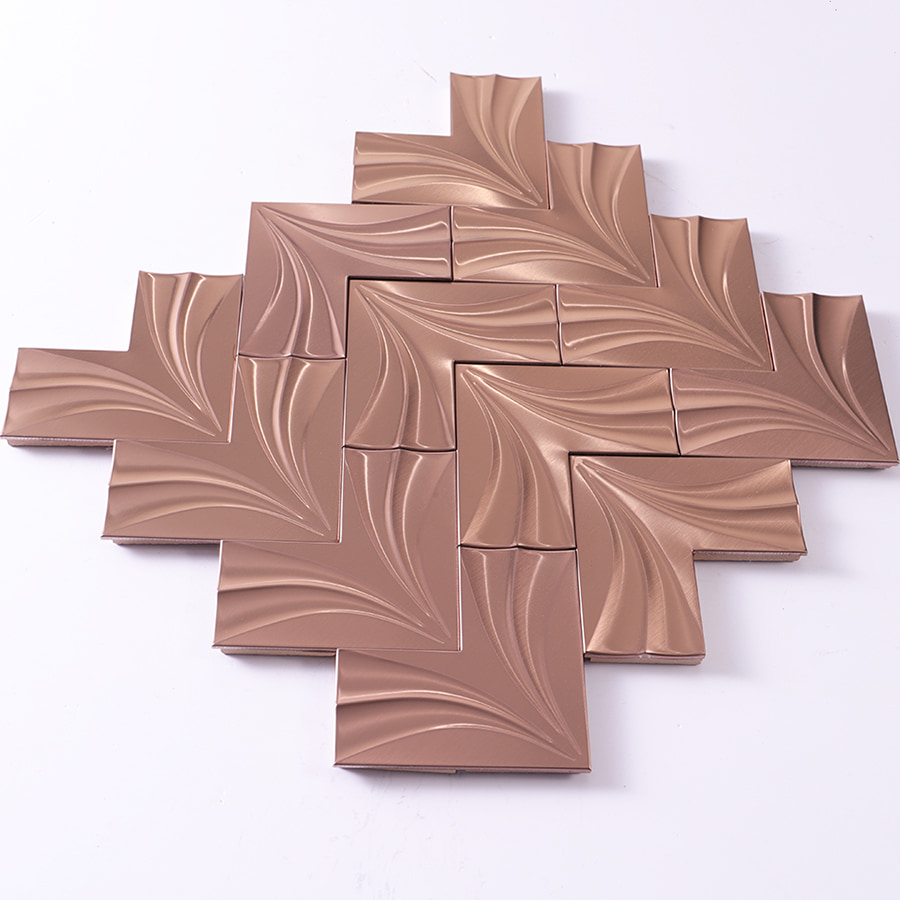 Angled view of rose gold 3D herringbone stainless steel mosaic tile sheet