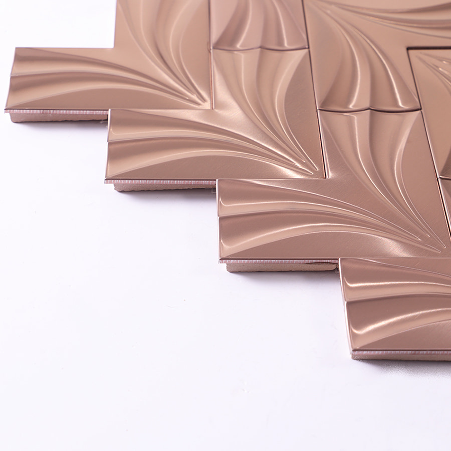 Side view showing thickness of rose gold herringbone stainless steel mosaic tile