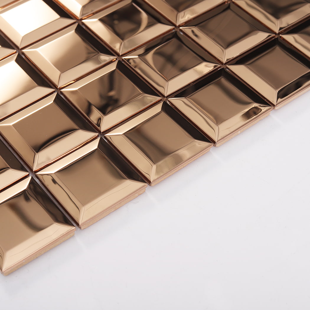 Angled side view of rose gold mirror beveled stainless steel mosaic tiles