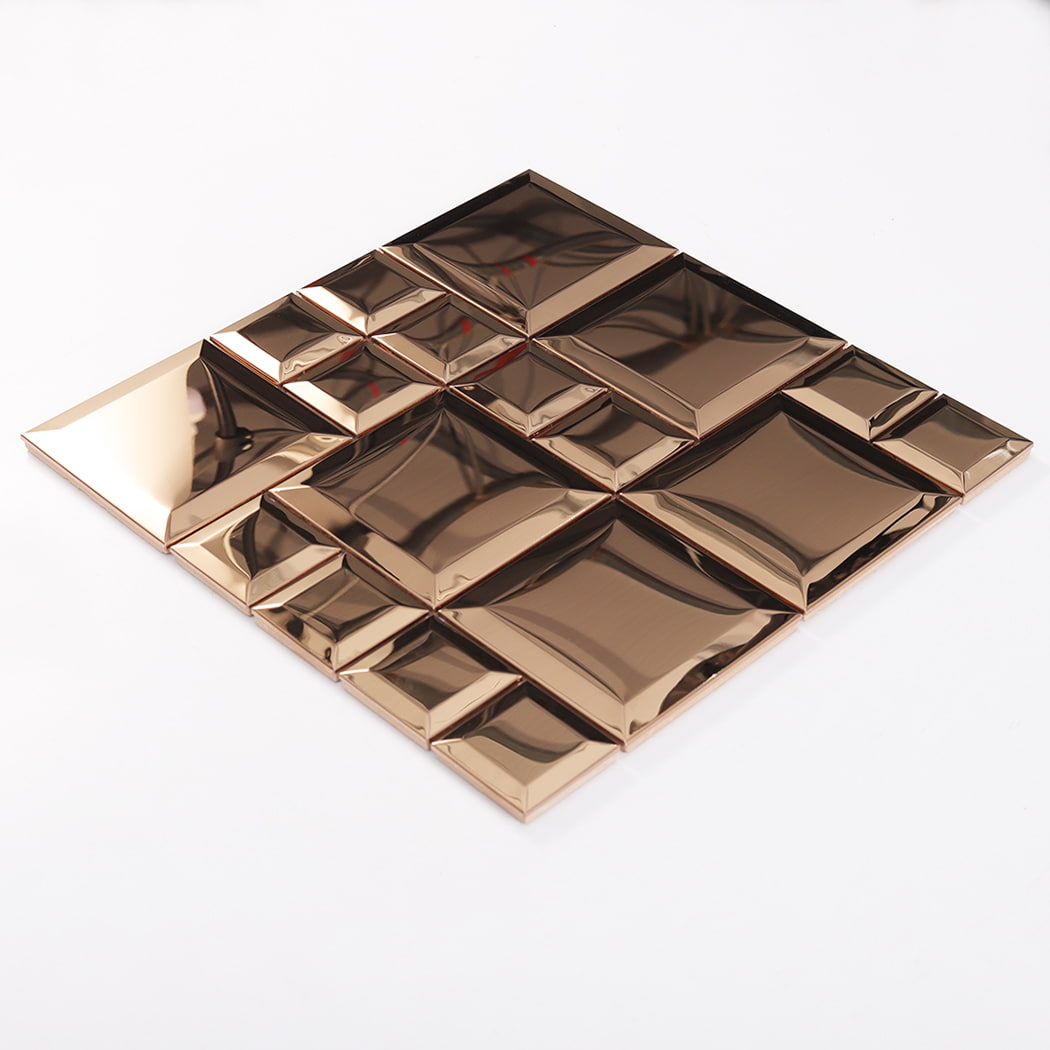 Angled view of rose gold stainless steel beveled modular mosaic tile surface