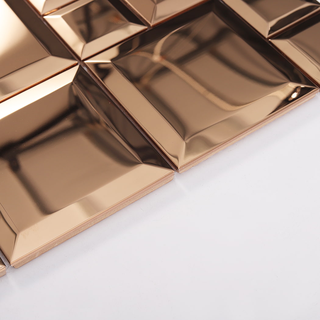Side view of rose gold stainless steel beveled tiles showing thickness and edges