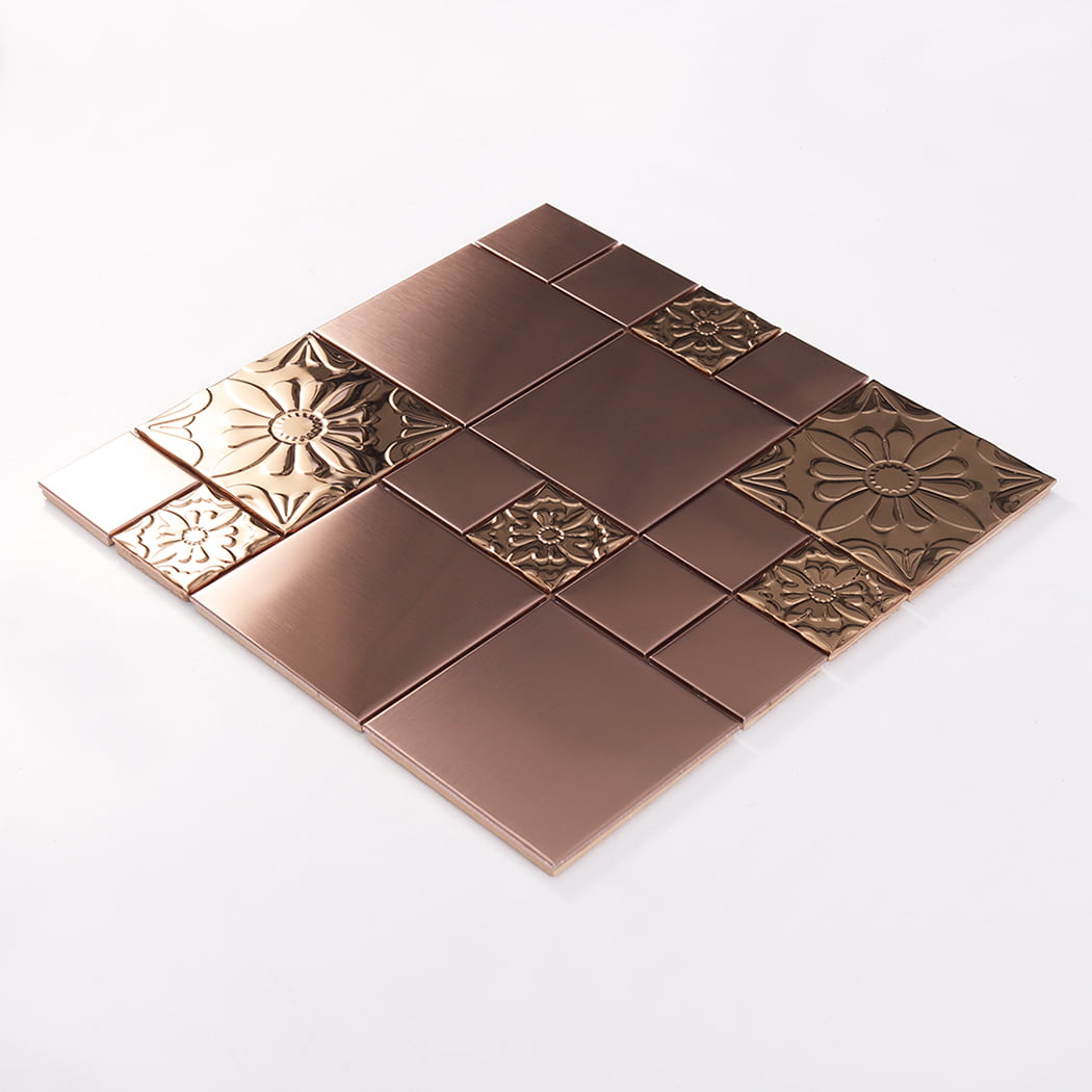Angled view of rose gold stainless steel mosaic tile with embossed floral design