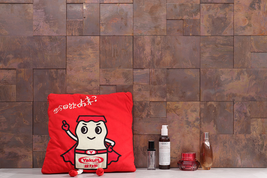 Rusted copper rectangle backsplash tiles with warm aged metal texture