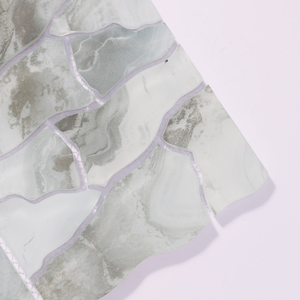 Close-up of sage green white irregular glass mosaic tiles with cloudy veining