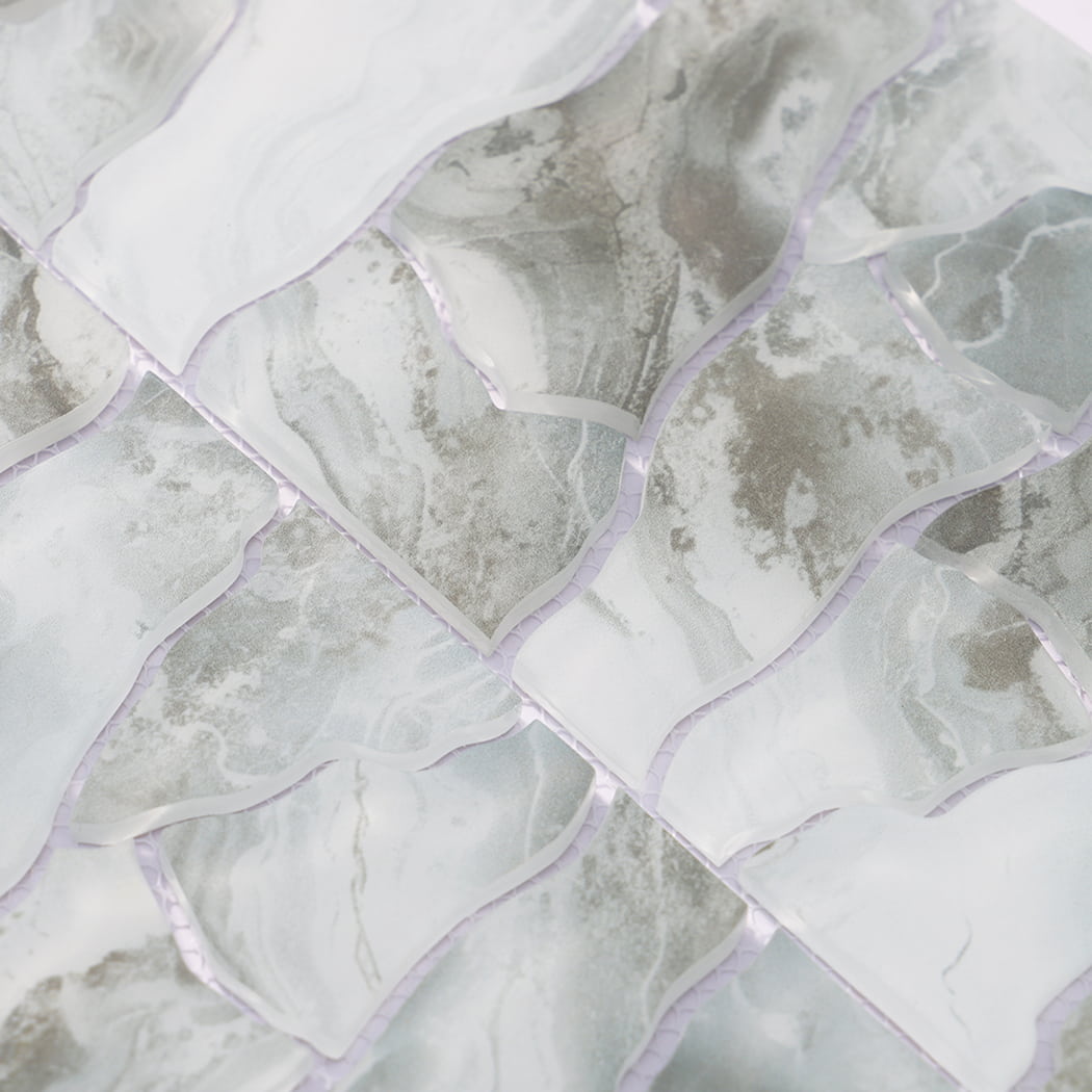 Detailed view of sage green white irregular glass mosaic tiles on mesh backing