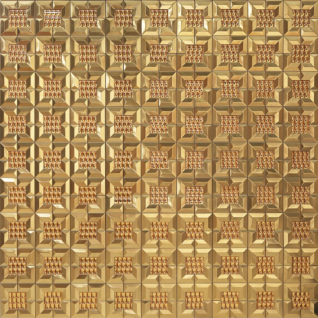 A large area of gold 3D mirror metal mosaic tiles forming a seamless luxury wall pattern.
