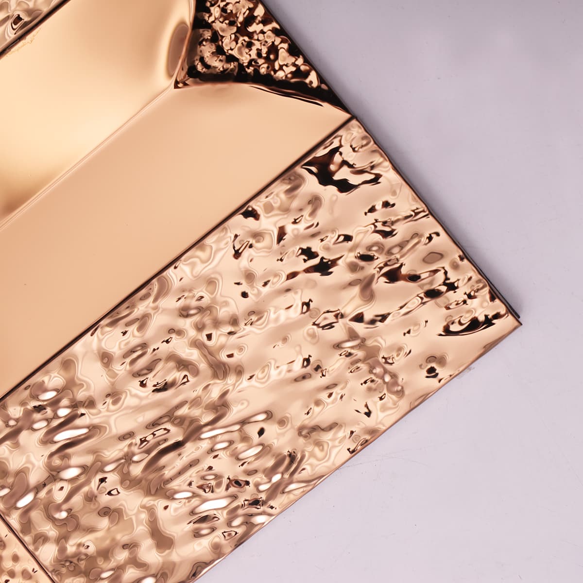 Full sheet of rose gold hammered and beveled stainless tiles