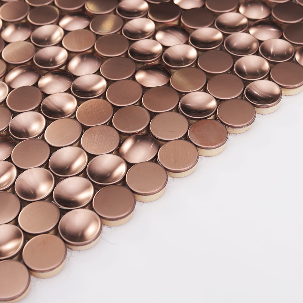 Side view showing the 3D depth of mixed profile rose gold stainless steel penny round tiles.