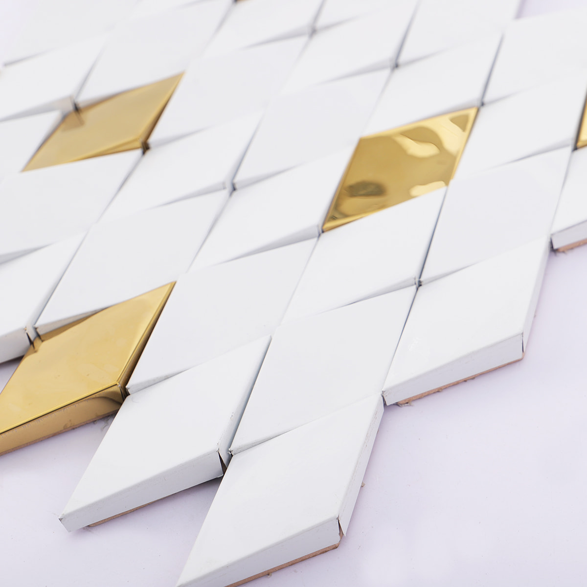 Profile view showing the 3D depth and thickness of diamond cut mosaic tiles.