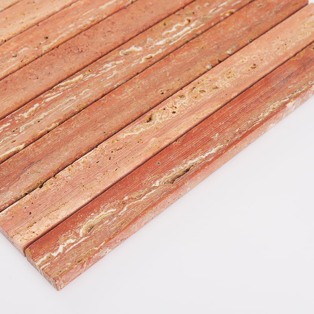A low angle side view highlighting the convex fluted profile of the Red Travertine mosaic.