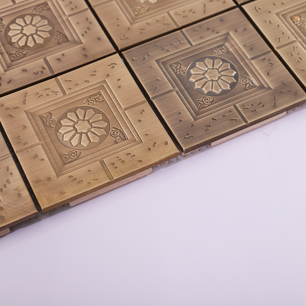 Side profile showing the raised floral design and tile thickness