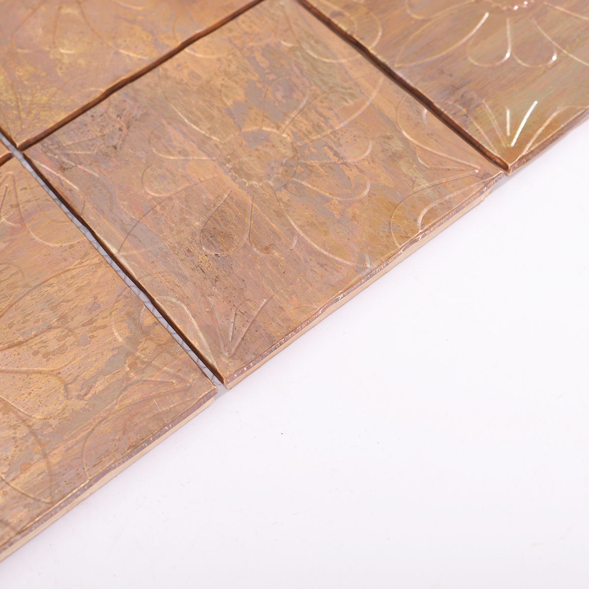 Side profile showing the depth and craftsmanship of the embossed tiles