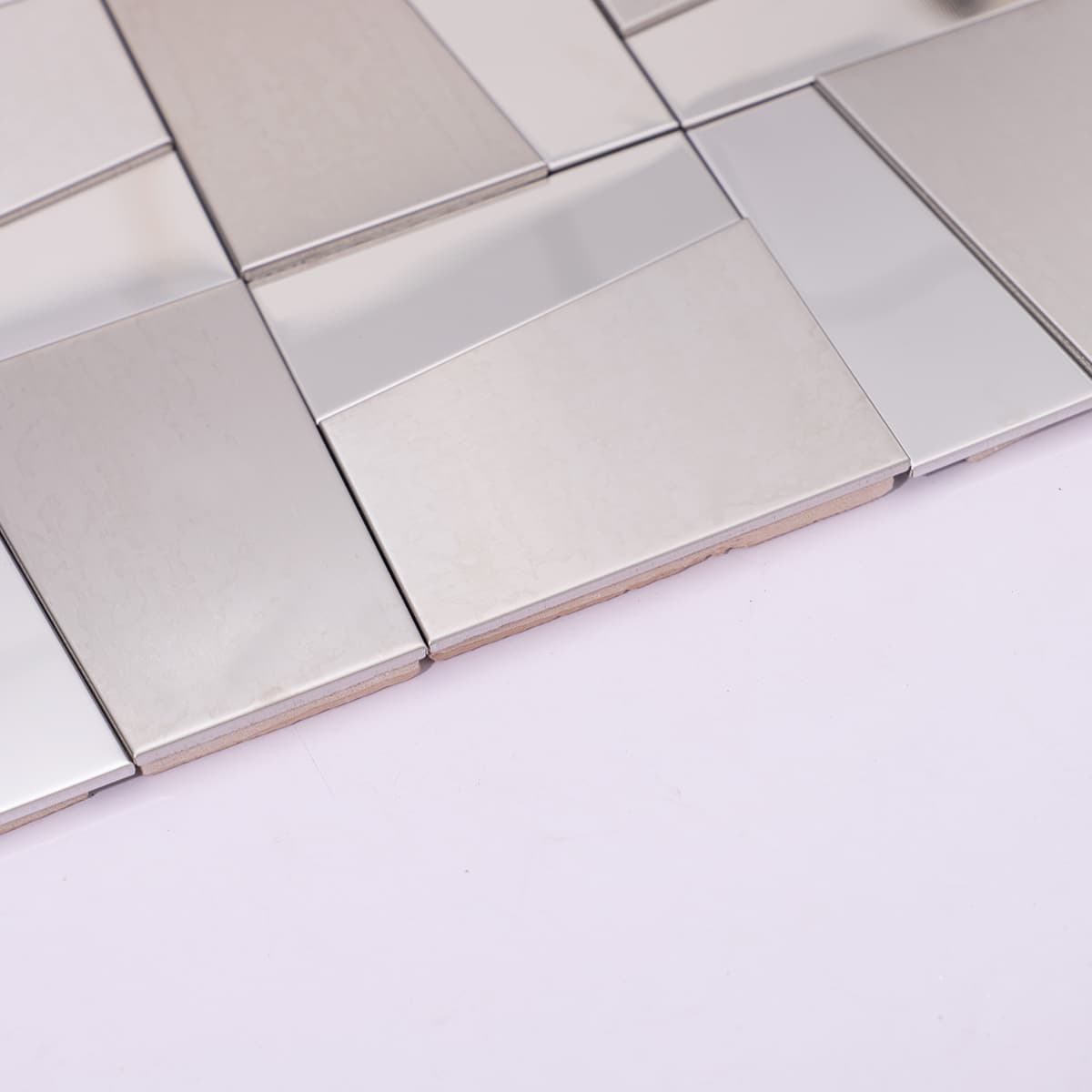 Side view showing thickness of stainless steel mosaic tiles