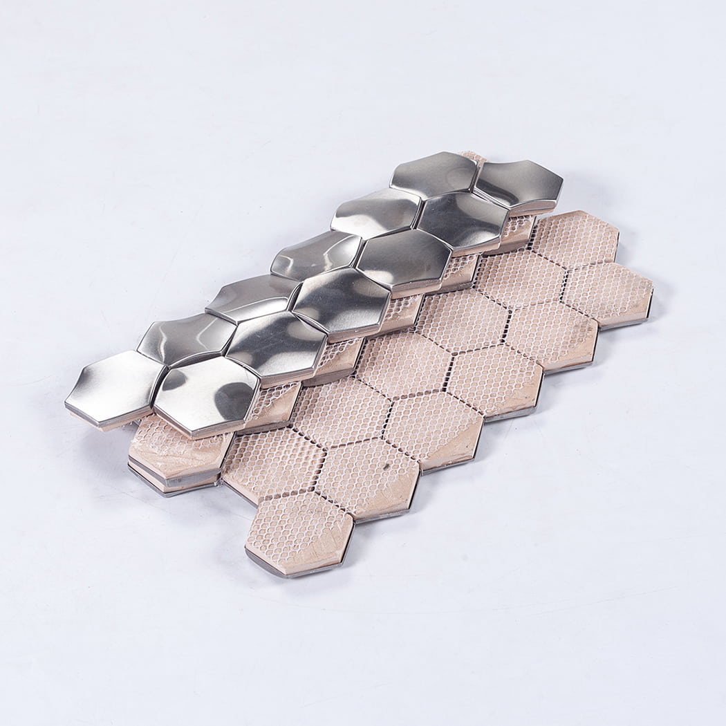 Rear view of silver 3D hexagon mosaic with white mesh backing.