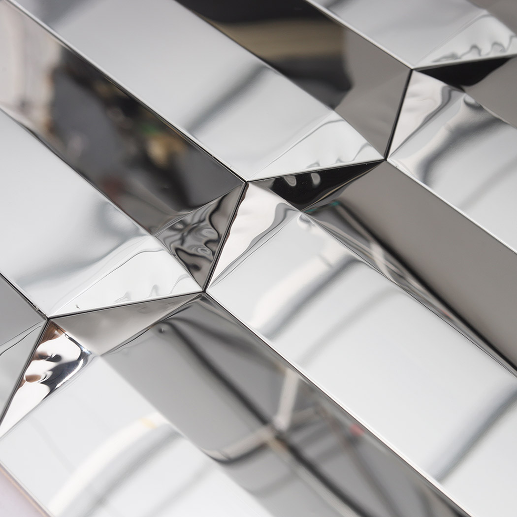 Silver mirror picket mosaic tile close up showing beveled joints and reflections