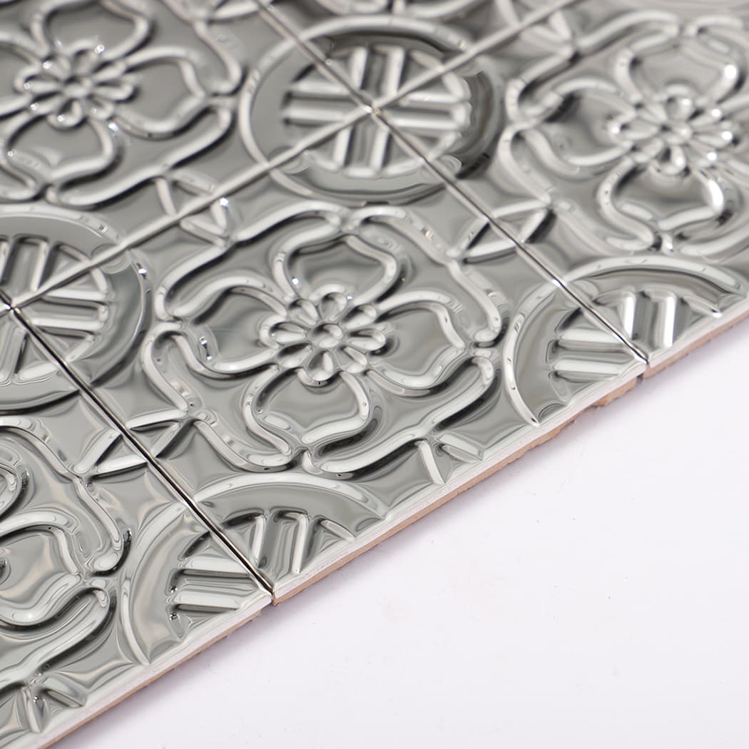 Side view showing edge profile and embossed height of silver stainless steel mosaic sheet.