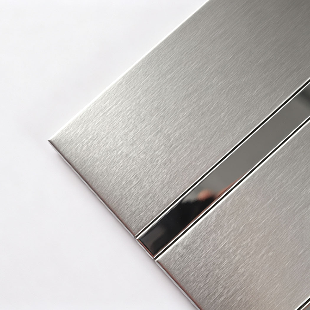 Corner close-up of brushed silver stainless steel striped tile