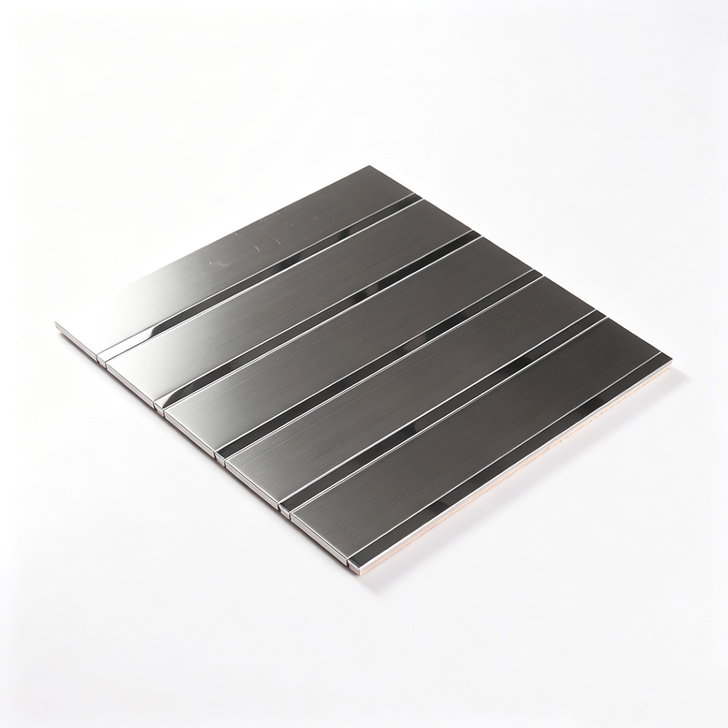 Angled view of a silver stainless steel striped tile sheet