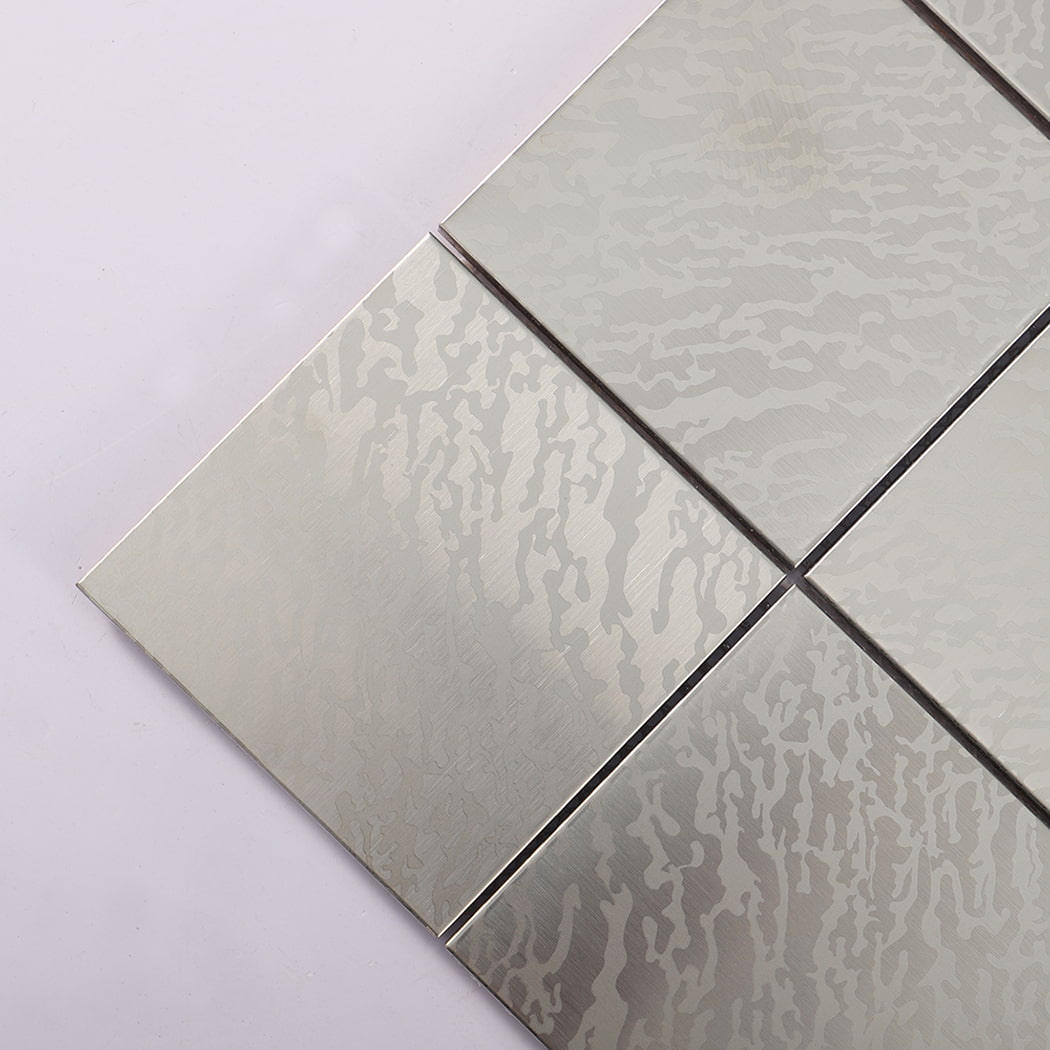 Corner close up of silver brushed square stainless steel metal
