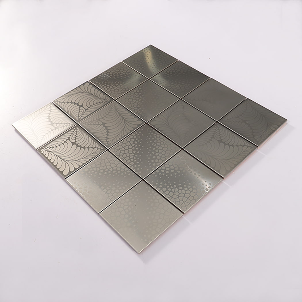 Angled view of silver brushed square stainless steel mosaic tile sheet on white background.