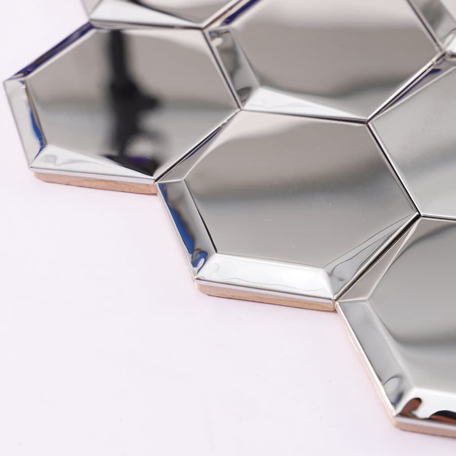 Edge view of silver hexagon mirror tile with backing
