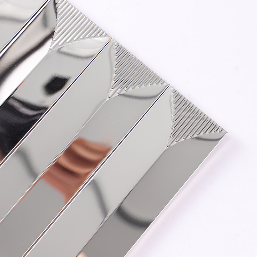 Corner close up showing polished silver surface and smooth edge finish