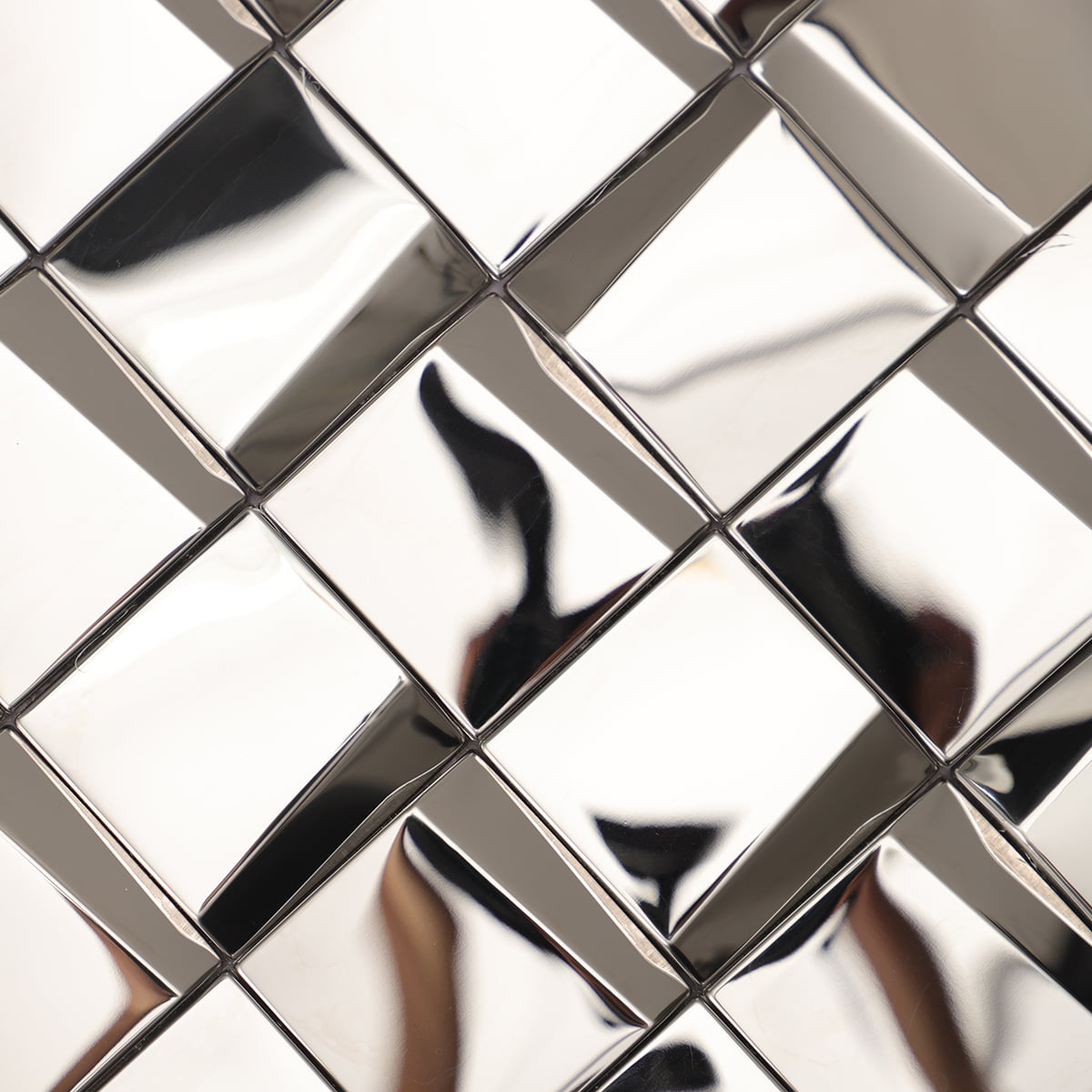 Silver square tiles with smooth surfaces and mirrored effect, detailed view