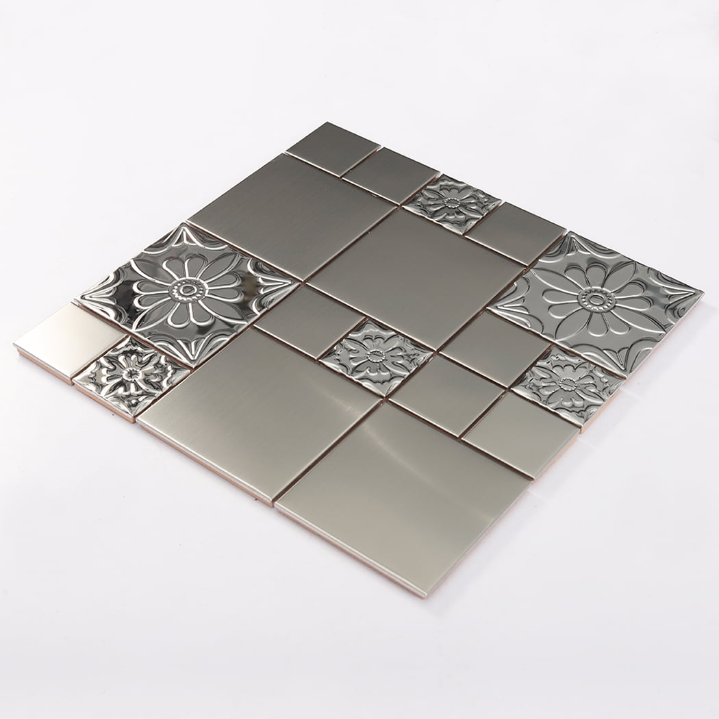 Angled view of silver stainless steel mosaic wall tile with embossed flower design