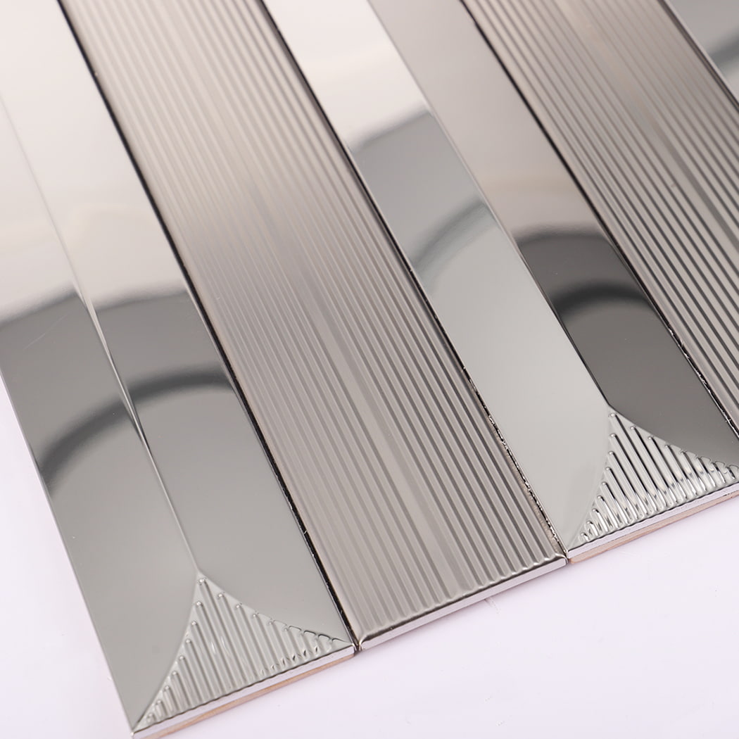 Side angle of silver stainless steel wall tile showing striped design