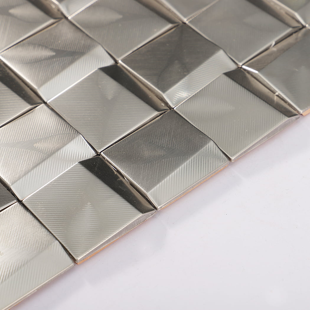 Angled edge close-up showing bevel and thickness of stainless steel square mosaic tiles.