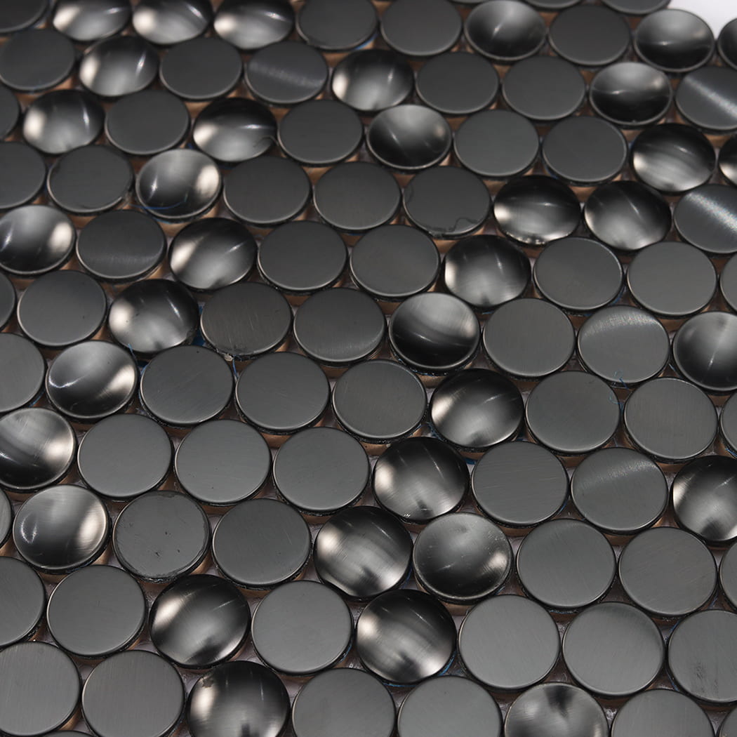 Macro view showing the mixed brushed flat and textured concave/convex stainless steel profiles.