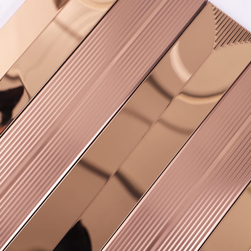 Detailed view of the highly reflective and ribbed textures on rose gold linear tile.