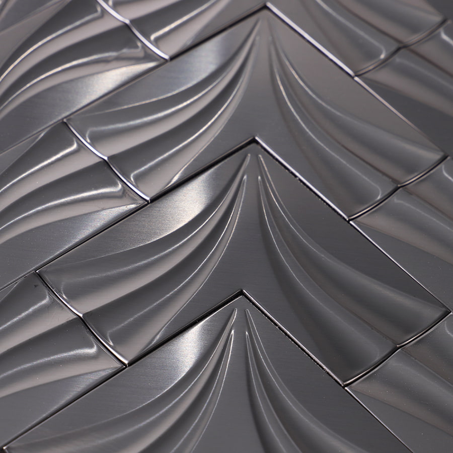 Surface detail of black stainless steel chevron mosaic tile