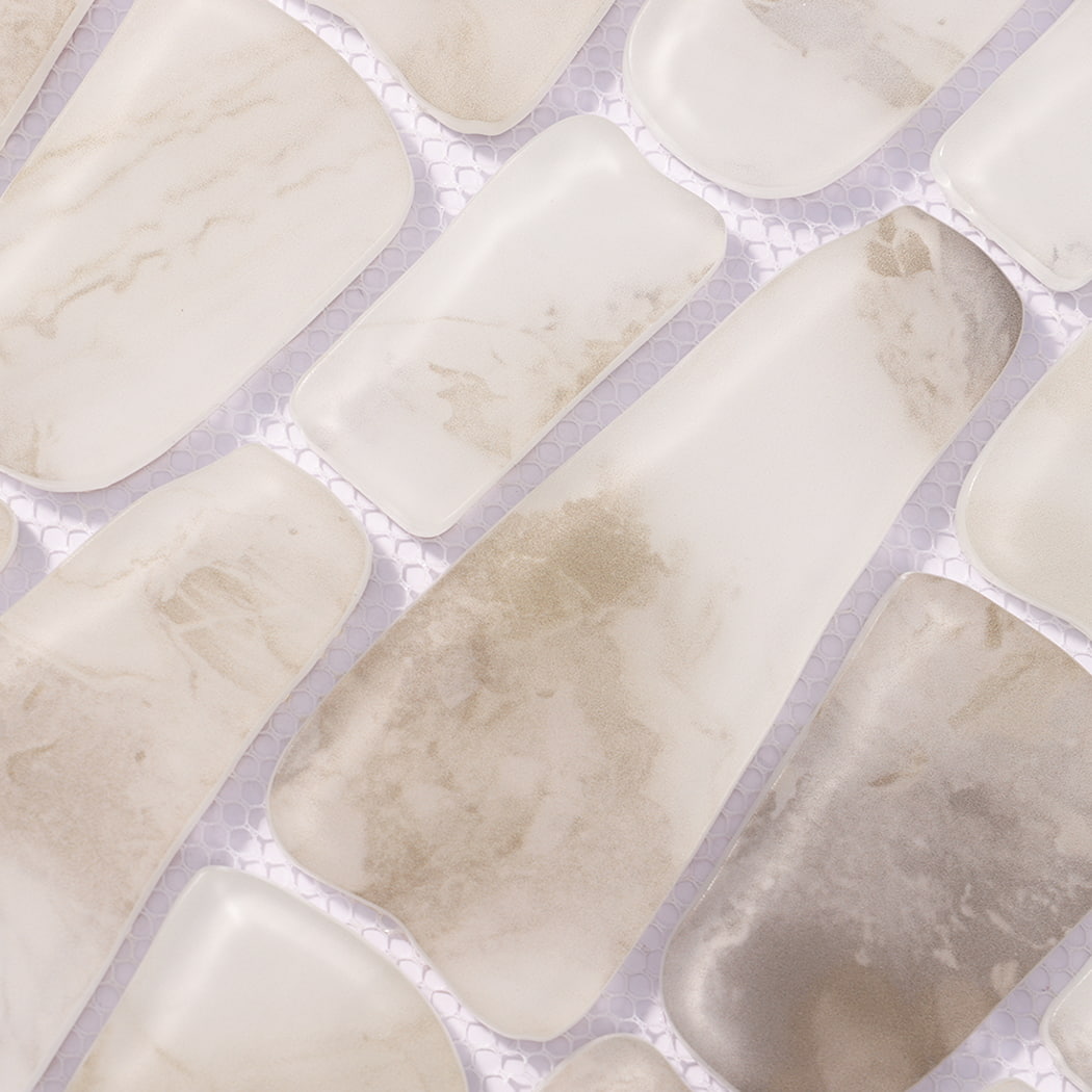 Detailed view of white beige gray irregular mosaic tiles on mesh backing