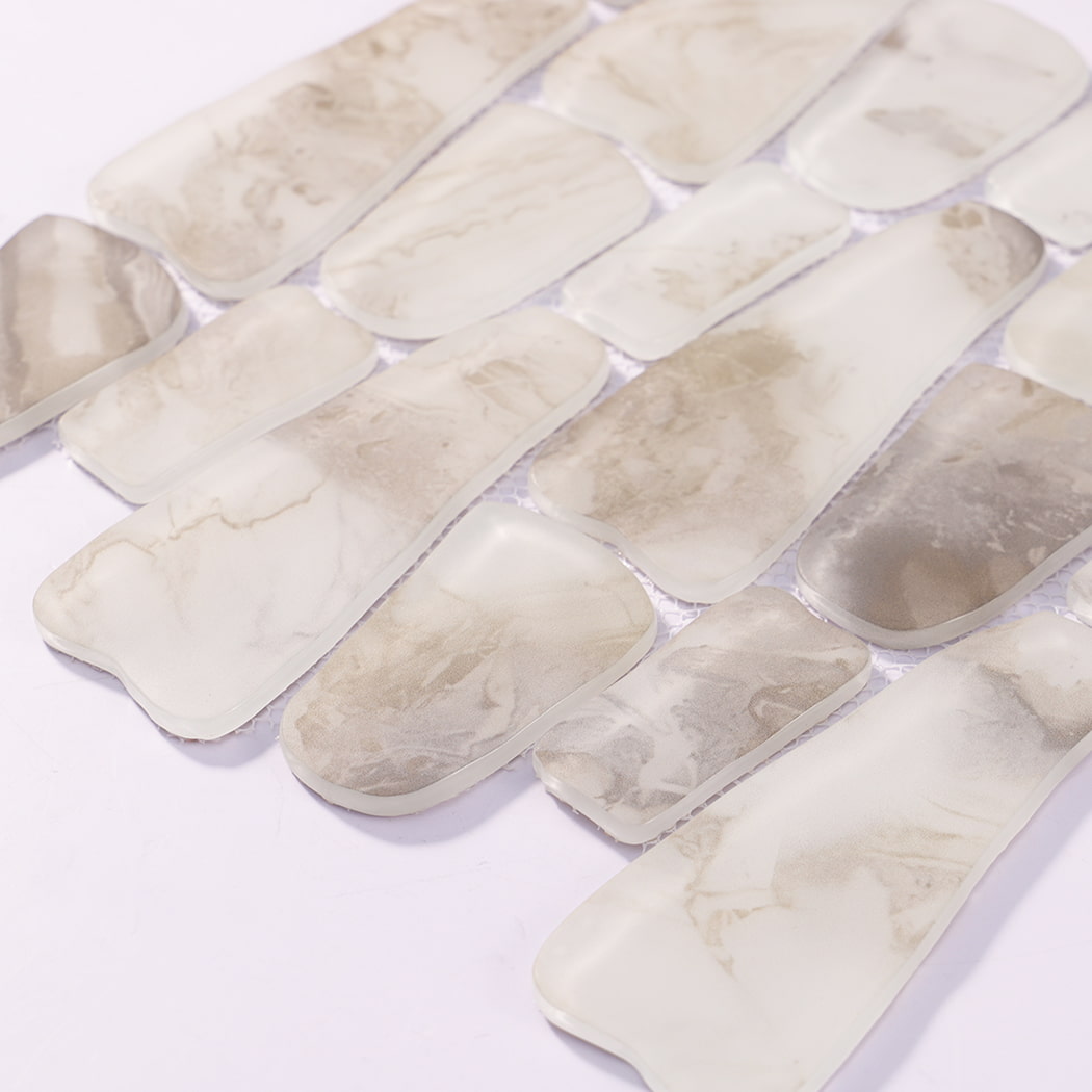 Angled view of white beige irregular mosaic tiles with rounded edges