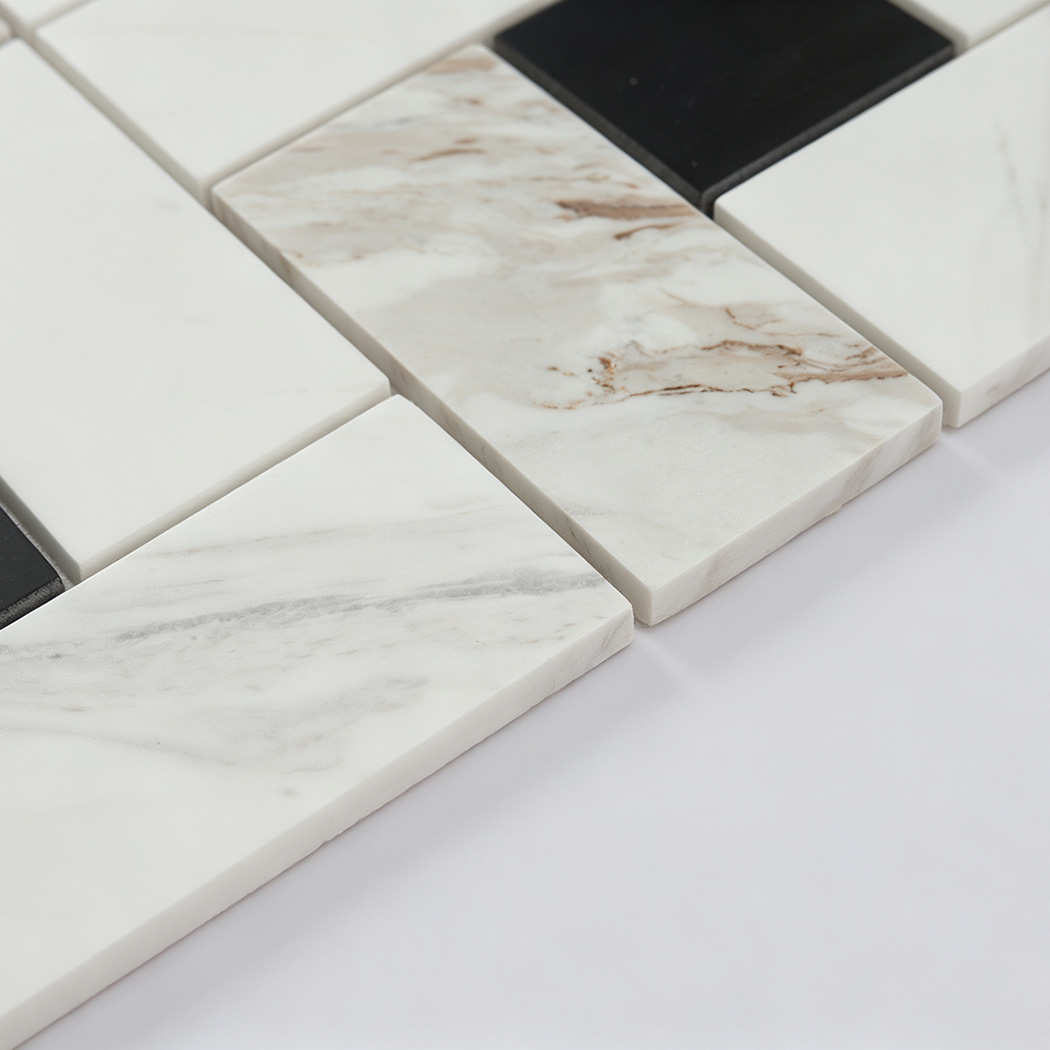 Angled view of white and black marble geometric mosaic tile pieces