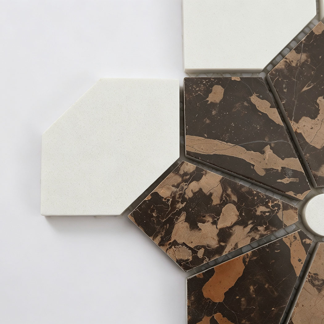 Close-up of white marble and brown floral mosaic tile pieces