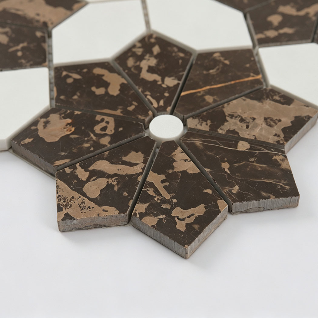 Close-up of brown marble flower mosaic with white stone accents