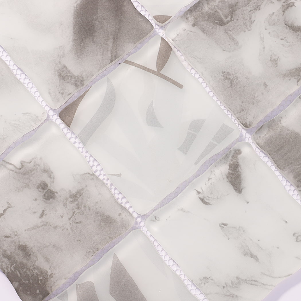 Surface detail of white gray abstract wavy square glass mosaic tiles
